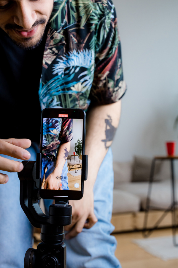 Creator filming with phone on gimbal