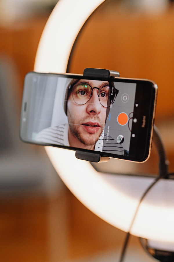 Creator filming with ring light