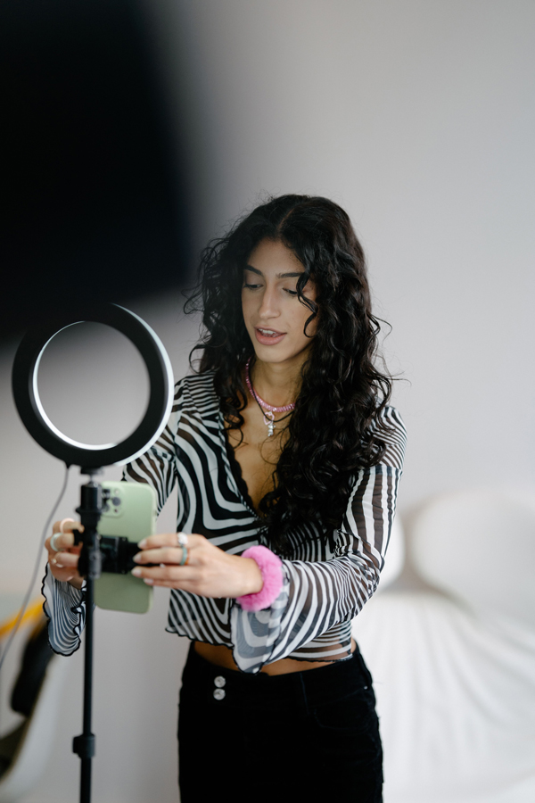 Creator with phone and ring light